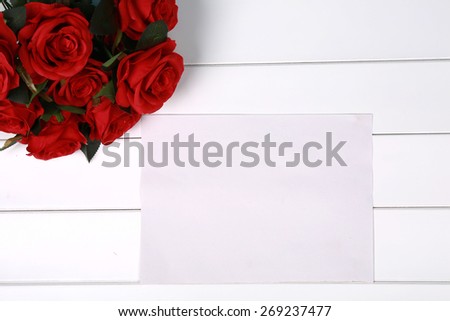 Roses flowers on Valentine\'s or mother\'s day on wooden board with copyspace for your own text