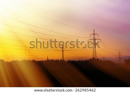 Electrical power lines. Electrical power and energy. Rays of light. Alternative energy