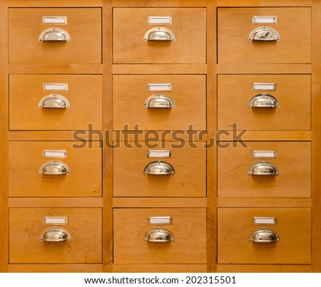 an old rectangular cabinet with twelve drawers