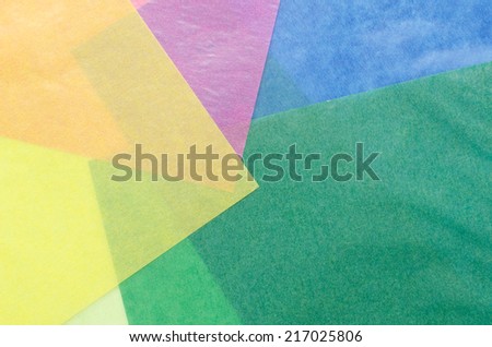 colorful translucent construction paper sheets thrown together