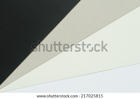 construction paper sheets arranged diagonally from black to white