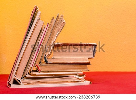 old books in front of a colorful background