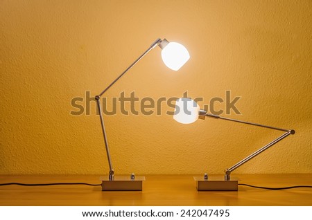 two lit lamps lamps interacting