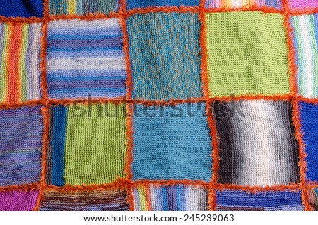 few blocks of a colorful handmade quilt blanket
