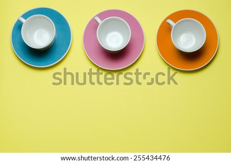 overview of three cups on colorful plates