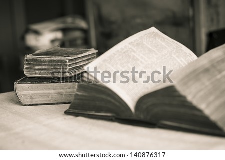 Library - Three old Bibles on the table