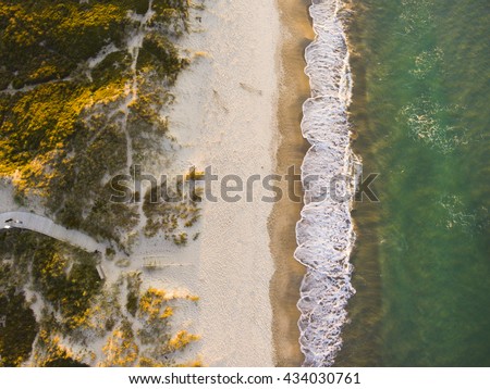 Drone shot. Aerial photography. East coast white sand beach aerial photography. Drone photography of a beach. Beautiful view from above.
