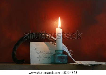 Antique quill and letters set on a mantle piece with a candle against a 'grunge' style background. Mood evocative shot. Copy space available.