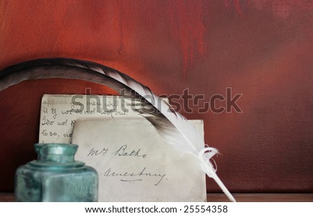 Period set up of a letter,quill pen and glass ink pot set on top of a wooden mantle against a red grunge background. All props recreated by self as artist.