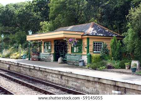 The station platform and waiting room at Harmans Cross Station, part of the Swanage Steam railway network in Dorset. A period setting evoking a nostalgic scene.
