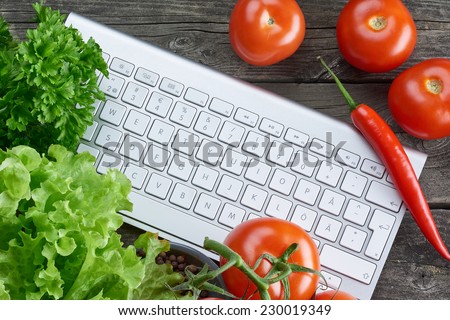 Keyboard and vegetables. Online recipe search.