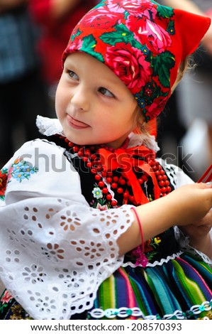 An unidentified young polish girl wearing traditional Lowicz national costume, Corpus Christi procession, Lowicz, Poland, circa June 2013