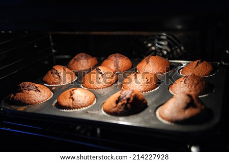 muffins on a baking tray in the oven close up
