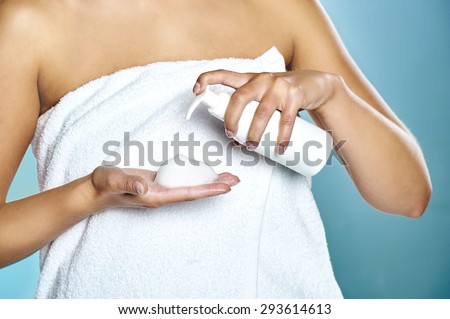 Female hands using cosmetic liquid soap or hand sanitizer close up