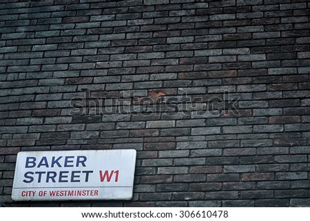 LONDON, UK - AUG 8: Brick wall with Baker Street sign. August 8, 2015 in London. The street was brought to fame by Sherlock Holmes\'s adventures