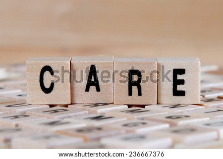 care word background on wooden blocks