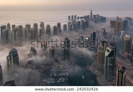 Dubai, UAE - December 30, 2014: Dubai Marina Skyline Under the fog in Dubai on  December 30, 2014  in the United Arab Emirates.