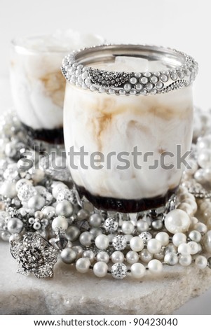 white russian cocktail on a marble surface with white background