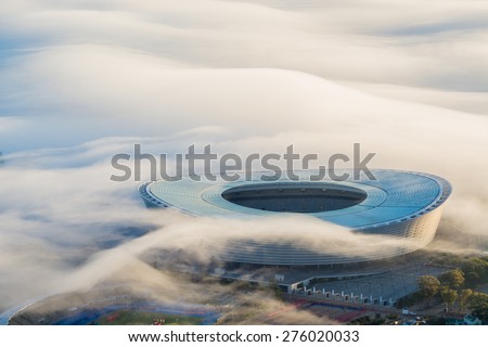 CAPE TOWN, SOUTH AFRICA - CIRCA APRIL 2015.The Cape Town Stadium is surrounded by fog in the early morning. The stadium was used during the 2010 FIFA World Cup.