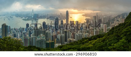 The famous view of Hong Kong from Victoria Peak. Taken at sunrise while the sun climbs over Kowloon Bay. The density of high-rise buildings is obvious in this shot.