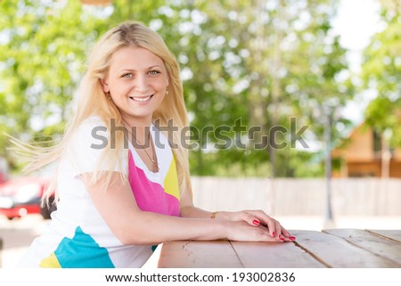 Closeup beautiful young woman enjoying nature on terrace in luxury cottage, spa resort, zen balance, summer vacation, harmony conception