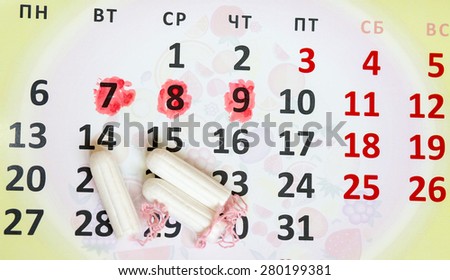 Woman hygiene protection, close-up.menstruation calendar with cotton tampons,Sanitary pads