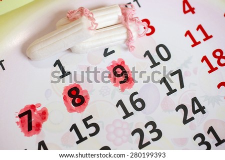 Woman hygiene protection, close-up.menstruation calendar with cotton tampons,Sanitary pads