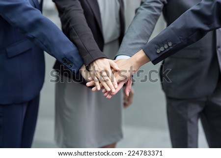 Business team joining hands