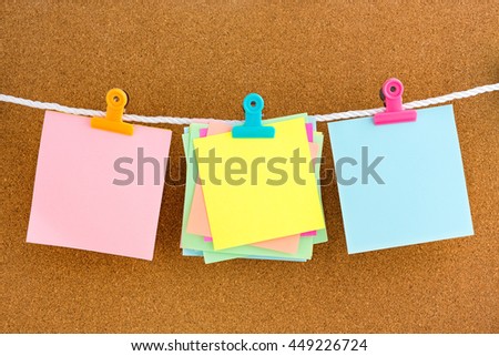 Blank notes with Letter Clips on cork bulletin board