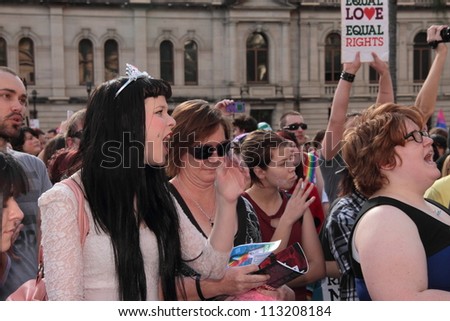 BRISBANE, QLD AUSTRALIA - AUGUST 11 : Unidentified people yelling support with speaker at gay marriage rally on August 11 2012  in Brisbane, Australia