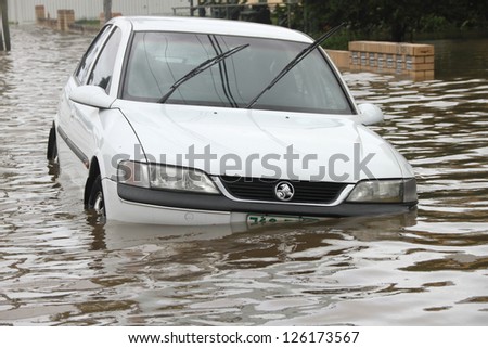 BRISBANE, AUSTRALIA - JANUARY 28 : Car submerged from ex tropical cyclone Oswald on January 28, 2013 in Brisbane, Australia