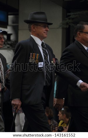 BRISBANE, AUSTRALIA - APRIL 25 : Veterans march along the route during Anzac day commemorations  April 25, 2013 in Brisbane, Australia