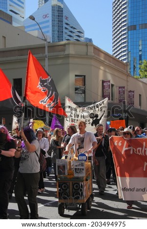 BRISBANE, AUSTRALIA - JULY 06 : Unidentified protesters marching during Bust The Budget anti liberal governement Rally July 06, 2014 in Brisbane, Australia
