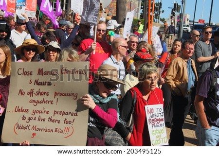 BRISBANE, AUSTRALIA - JULY 06 : Unidentified protesters marching during Bust The Budget anti liberal governement Rally July 06, 2014 in Brisbane, Australia