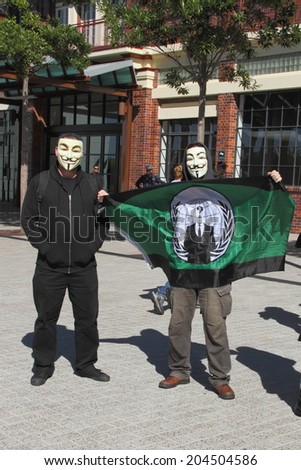 BRISBANE, AUSTRALIA - JULY 12 : Unidentified anonymous protesters outside Liberal National Party national conference July 12, 2014 in Brisbane, Australia