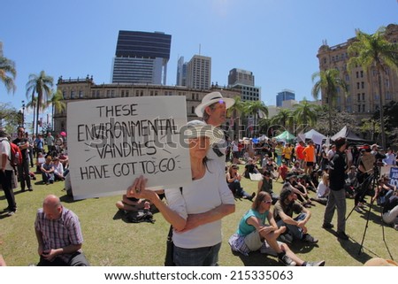 BRISBANE, AUSTRALIA - AUGUST 31: Unidentified protester with anti government environment policy signs at March Australia Rally August 31, 2014 in Brisbane, Australia