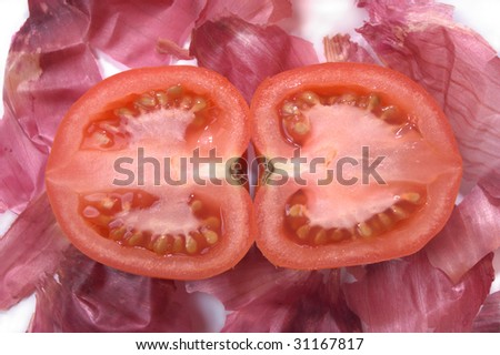 tomato half on bed of red onion skins