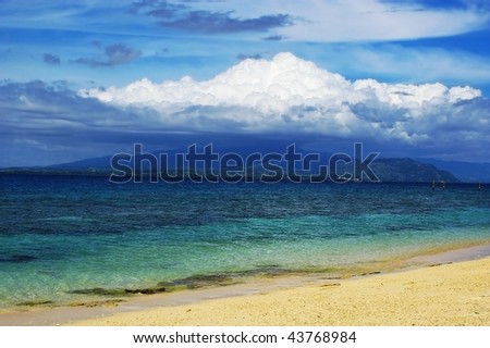 Dramatic backdrop of large mushroom cloud over Fiji