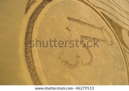 stock photo male penis graffiti drawn into beach sand by pranksters