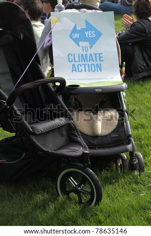 BRISBANE, AUSTRALIA - JUNE 6 : Say yes to climate action protest sign on next generation pram at World Environment Day protest 6, 2011 in Brisbane, Australia