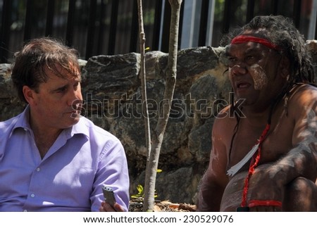 BRISBANE, AUSTRALIA - NOVEMBER 14: International media interviewing aboriginal leader during g20 aboriginal deaths in custody protest on November 14, 2014 in Brisbane, Australia