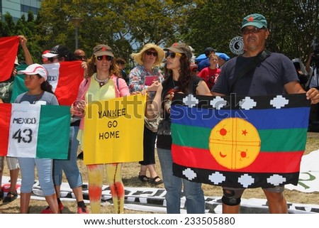 BRISBANE, AUSTRALIA - NOVEMBER 15: Undientified people protesting missing student teachers in mexico at g20 rally on November 15, 2014 in Brisbane, Australia