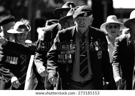 BRISBANE, AUSTRALIA - APRIL 25 : Veterans march along the route during Anzac day centenary commemorations April 25, 2015 in Brisbane, Australia