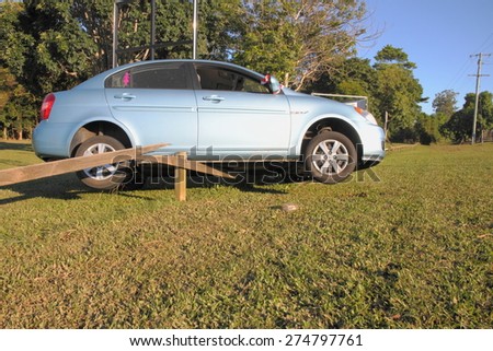 MORAYFIELD, AUSTRALIA - MAY 2: Car that was washed away during flash flood and left dry on fence, flood killed five in cars on May 2, 2015 in Morayfield, Australia