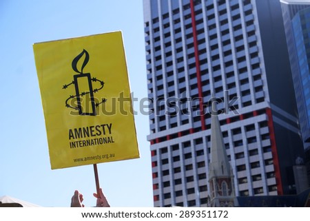 BRISBANE, AUSTRALIA - JUNE 20: Amnesty International placard at World Refugee Day Rally June 20, 2015 in Brisbane, Australia