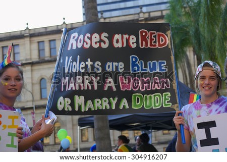 BRISBANE, AUSTRALIA - AUGUST 8 2015:Unidentified rally goers with pro-gay marriage sign at Marriage Equality Rally August 8, 2015 in Brisbane, Australia