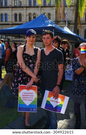 BRISBANE, AUSTRALIA - AUGUST 8 2015: Unidentified rally goers with support placards of Marriage Equality Rally August 8, 2015 in Brisbane, Australia