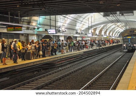 ROME, ITALY - JUNE 24, 2014: People waiting for a train at Termini subway station