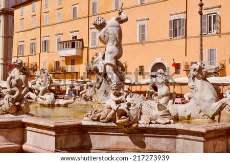 Vintage looking Fontana dei Quattro Fiumi meaning Fountain of the Four Rivers in the Piazza Navona square designed in 1651 by Gian Lorenzo Bernini