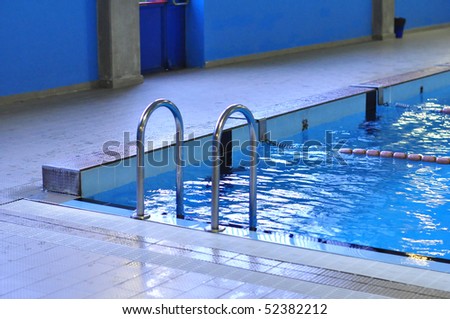 Swimming pool with blue water useful as background